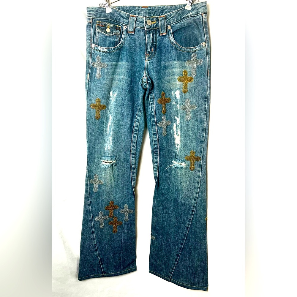 Distressed beaded wide flare jeans.
